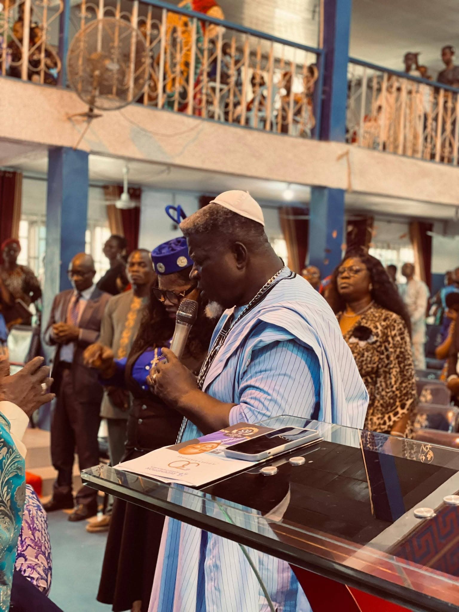 The pastor greeting a member during the 30th anniversary celebration